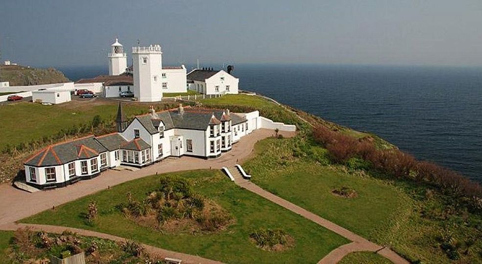 Panoramic view of the Hostel and the Lizard lighthouse behind