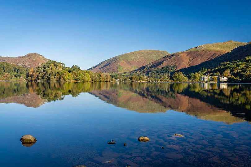 An aerial view of High Close in autumn colours showing Grasmere beyond